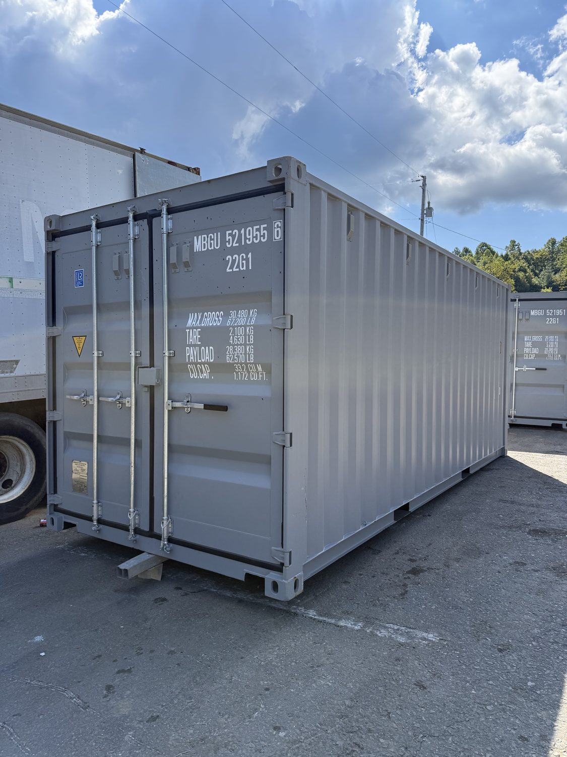 Cutaway anatomy of a shipping container showing wall, floor, and door construction