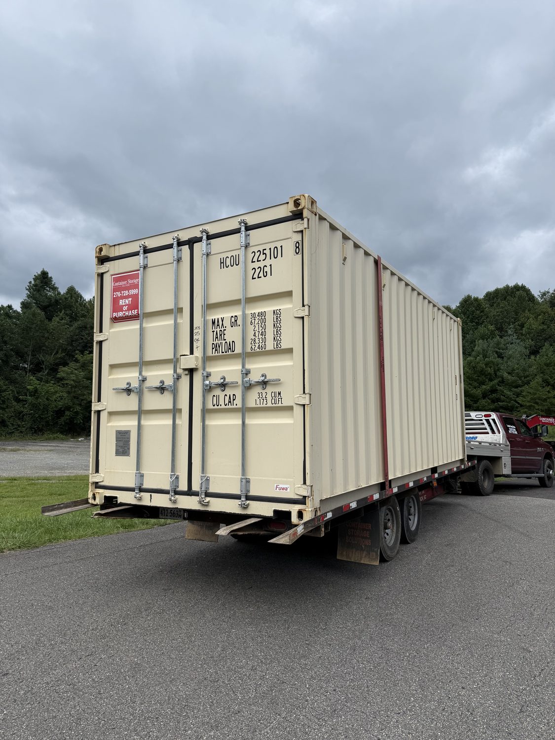 Container converted into a finished mobile office with door and windows